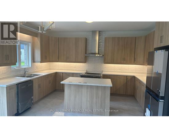 A kitchen with wooden cabinets and a central island.