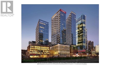 A tall building with a red sign on it.