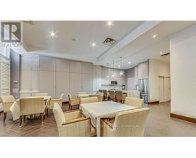 A dining room with a table set for six people.