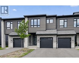 A modern two-story house with a garage is for sale.