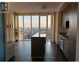 A modern kitchen with a view of the city.