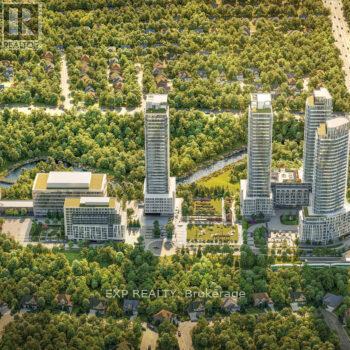 An aerial view of a city with tall buildings and a lot of greenery.