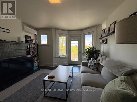 A living room with a grey couch and a coffee table.