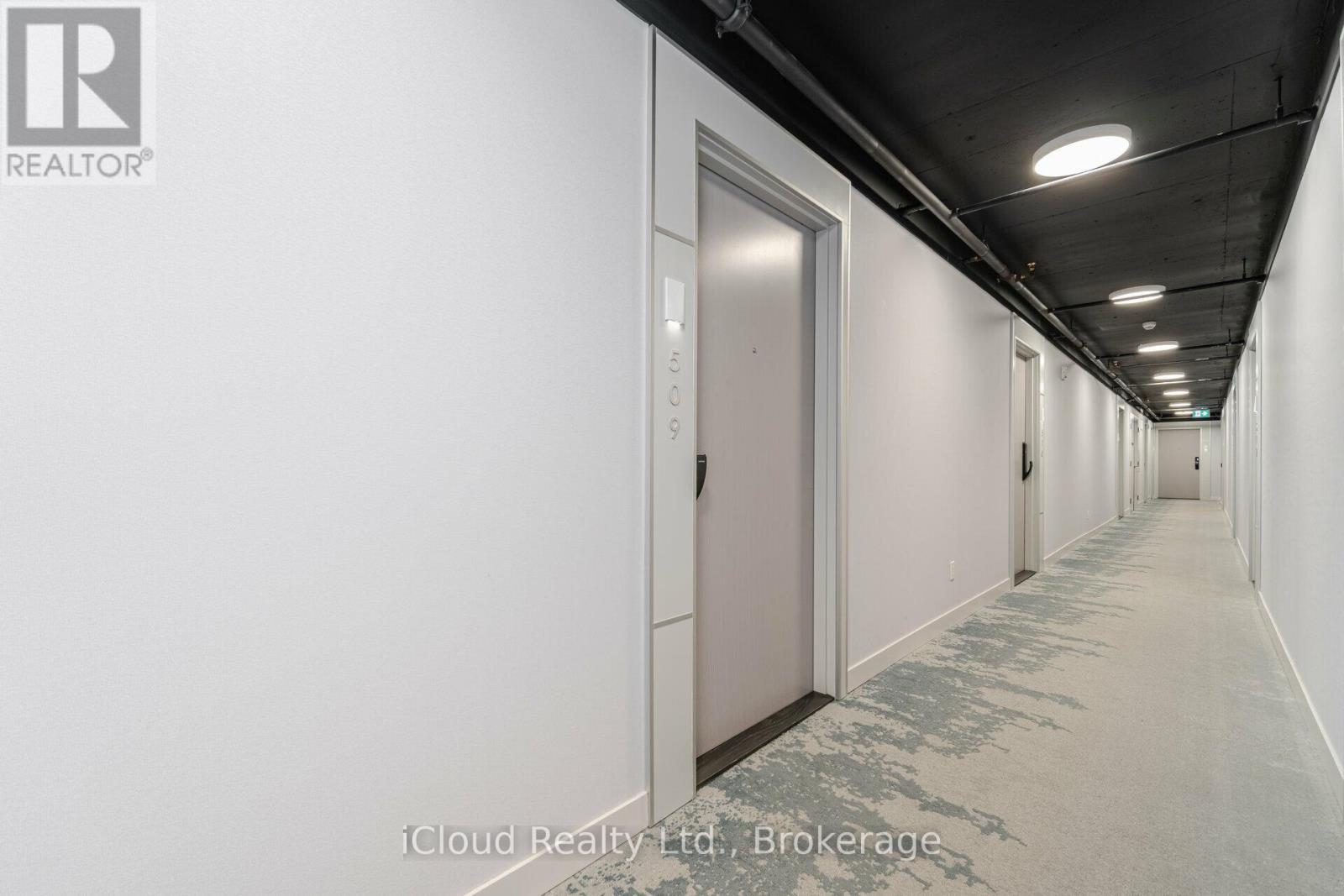 A long hallway with doors on both sides.