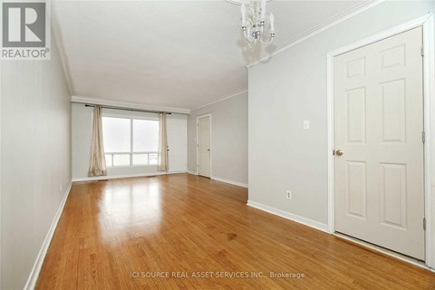 A room with wooden floors and white walls.