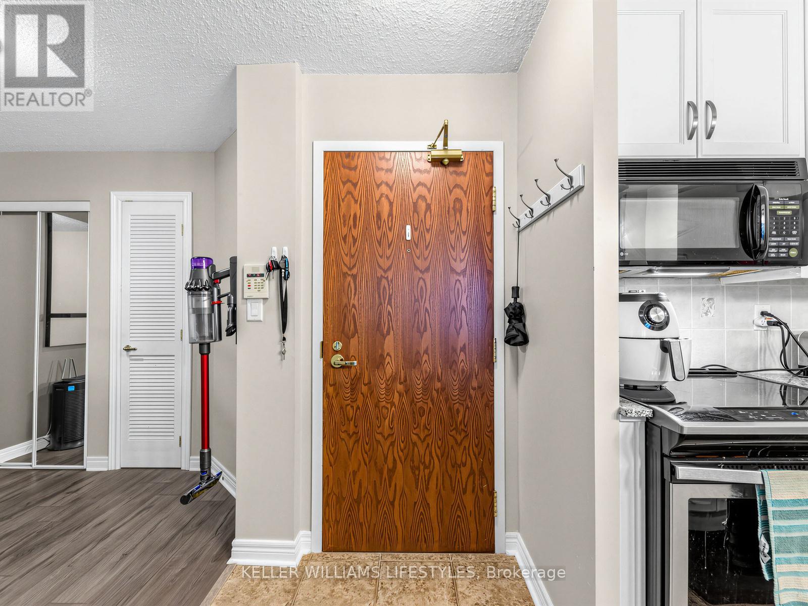 A brochure for a realtor showing a kitchen with a wooden door.