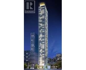 A tall building with a lit up top and the logo REALTOR on the top left.