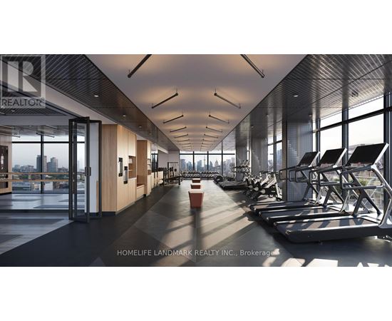 A gym with treadmills and a view of the city.