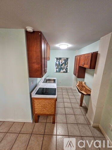 A kitchen with a sink and a counter.