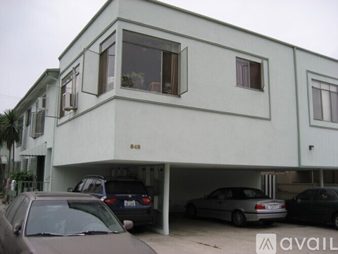 A two-story building with the number 848 on the front.