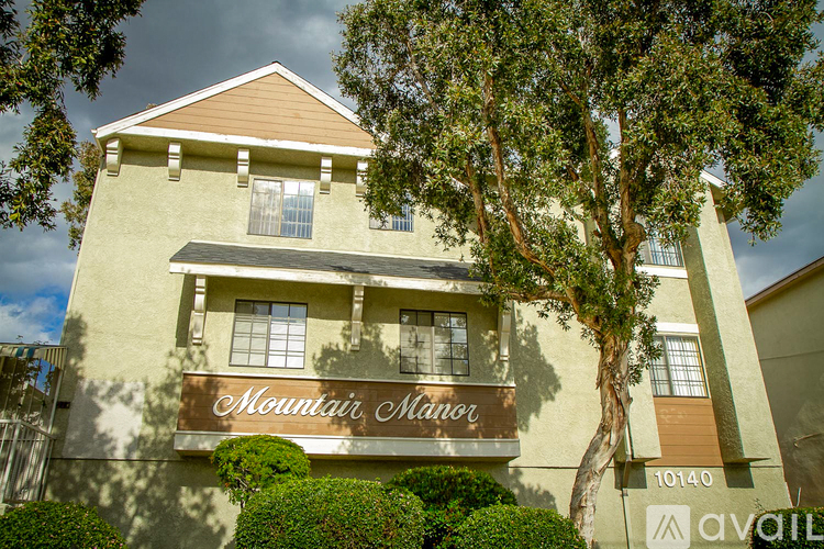 A building with the sign "Mountain Manor" is shown.