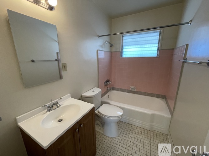 A bathroom with a sink, toilet, and bathtub.