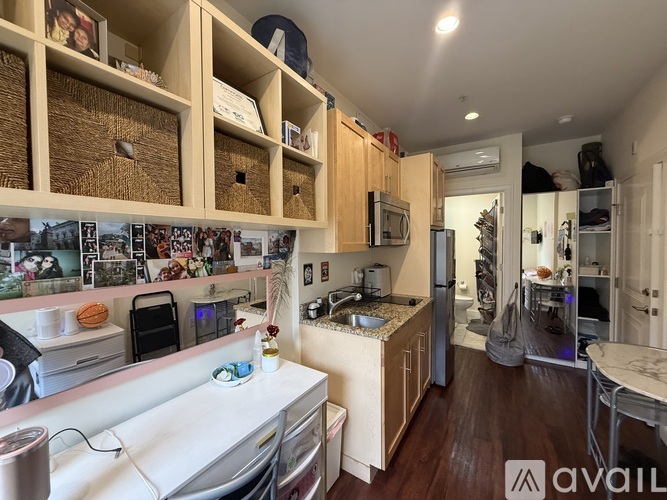 A kitchen with wooden cabinets and a white countertop.