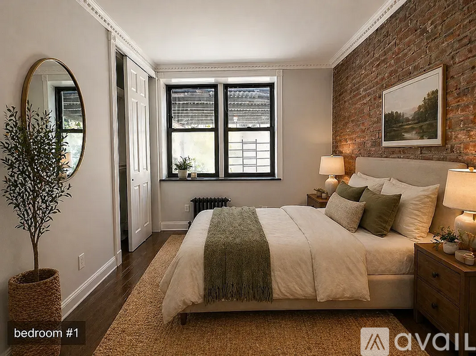 A bedroom with a large bed and a potted plant.