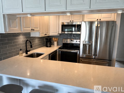 A modern kitchen with a large island in the middle.