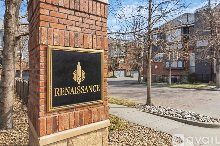 A sign for Renaissance stands in front of a building.