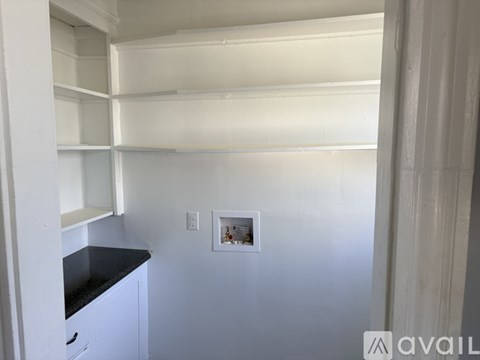 A small picture is hanging on the wall.