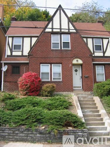 A house with a red door and a white window.