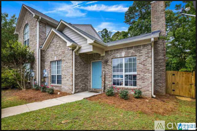 A house with a blue door and a stone facade.