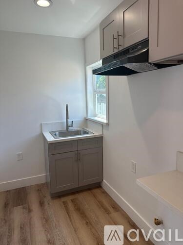 A kitchen with a sink and cabinets.