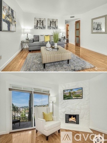 A living room with a grey sofa and a coffee table with a striped cushion.