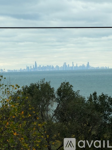 A city skyline is visible through a hazy atmosphere.