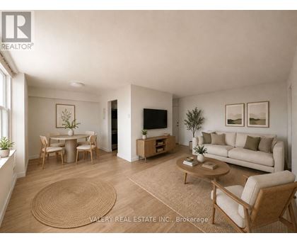 A living room with a couch, chairs, and a coffee table.