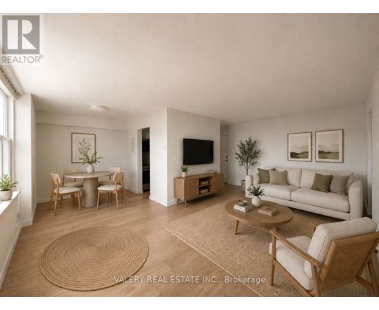 A living room with a couch, chairs, and a coffee table.