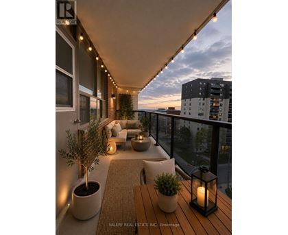 A balcony with a table, chairs, and plants.