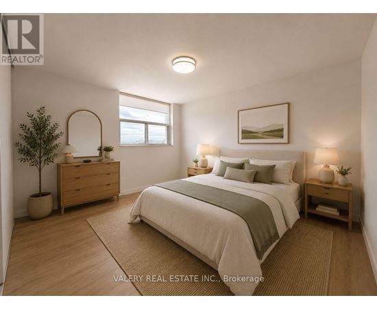 A bedroom with a bed, nightstand, and a plant.