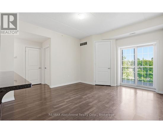 A room with a sliding glass door leading to a balcony.