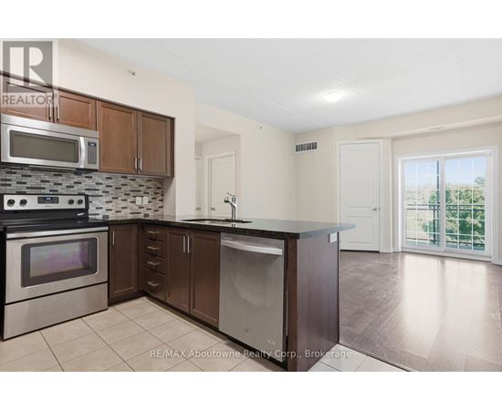 A kitchen with a stove top oven, microwave, and dishwasher.