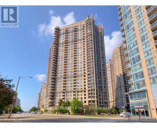 A tall residential building with a balcony on the 10th floor.