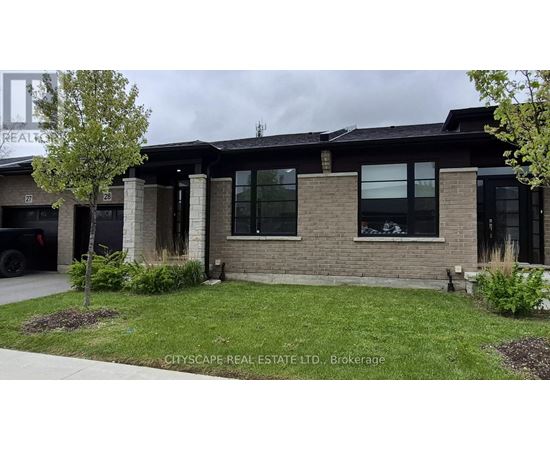 A modern house with a black roof and a brick facade.
