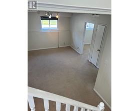A room with a window and a door is on the market.
