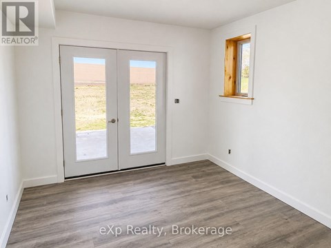 A room with a sliding door and a window.