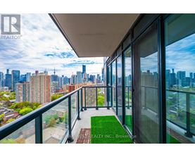 A balcony with a view of a city skyline.