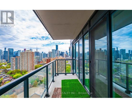 A balcony with a view of a city skyline.