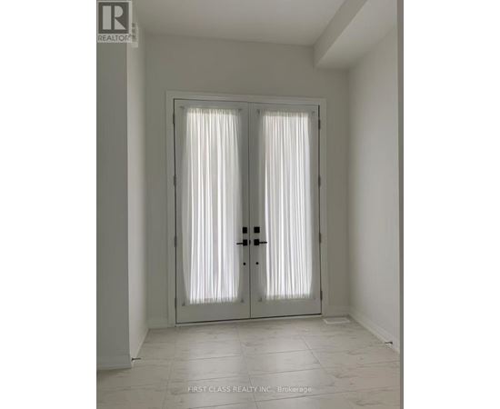 A white door with a glass panel and a black handle.