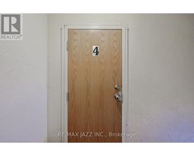 A wooden door with the number 4 on it.