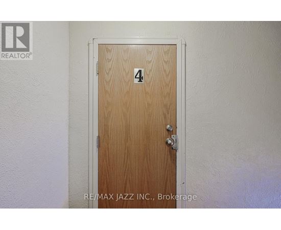 A wooden door with the number 4 on it.