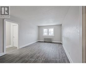 A room with a window and a radiator is available for rent.