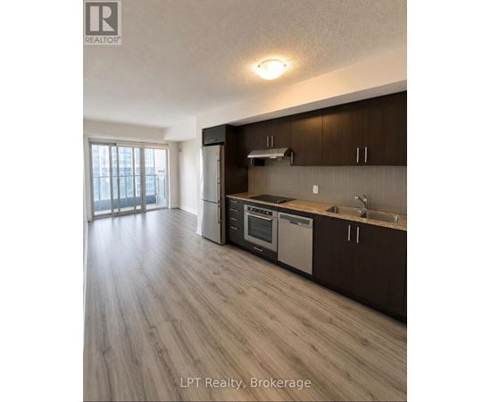A kitchen with wooden cabinets and a stainless steel dishwasher.