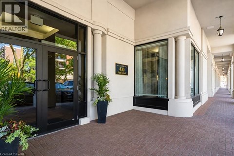 A building entrance with a glass door and a sign that says REALTOR.