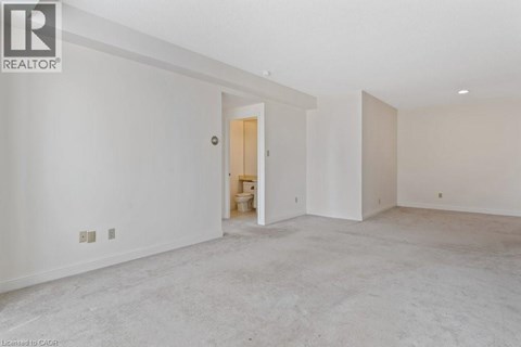 A room with a doorway leading to another room.