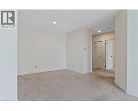 A spacious room with a door on the right side.
