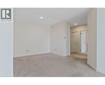 A spacious room with a door on the right side.