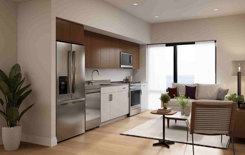 A modern kitchen with stainless steel appliances and a dining area with a chair and table.
