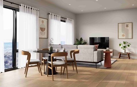 A modern living room with a dining table and chairs.