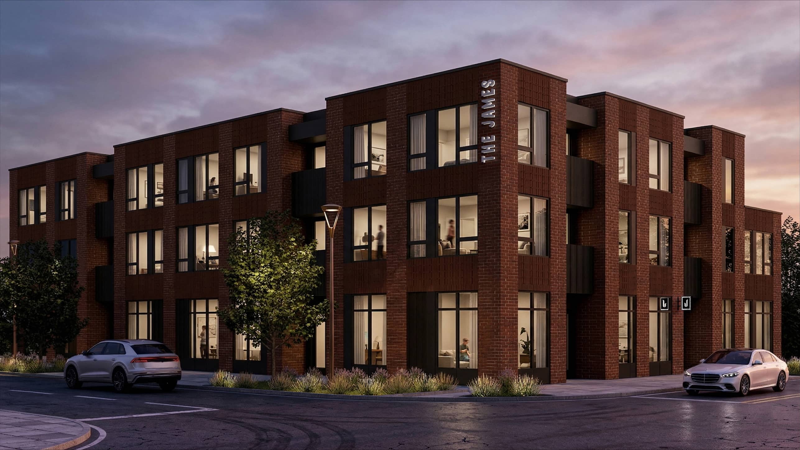 A modern brick building named The Lamers is depicted with cars parked in front.